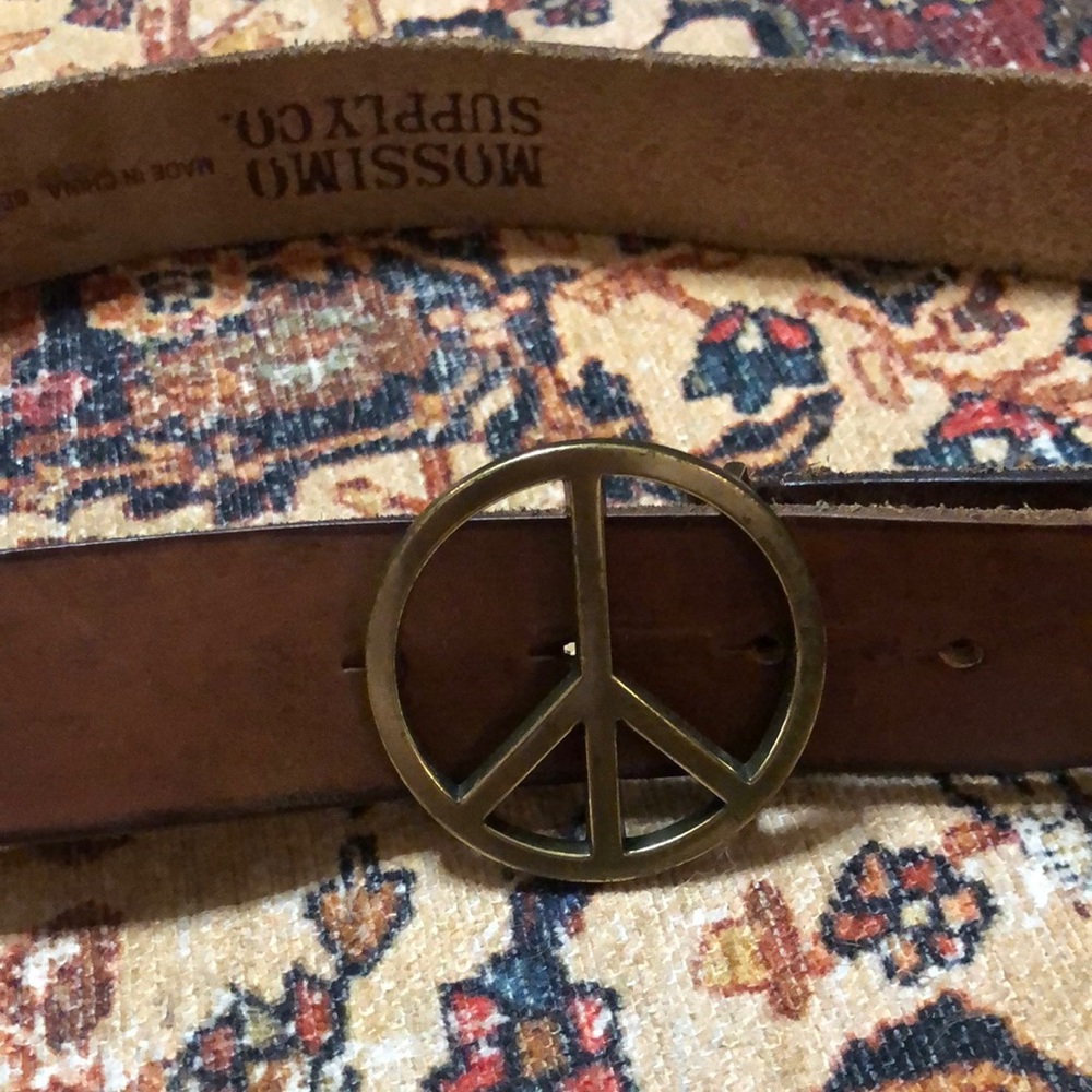 Leather belt with gold metal peace sign clasp